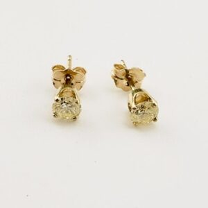 Round Diamond Studs Earrings set in 14K Yellow Gold. Approx .85 ct. Total Weight.