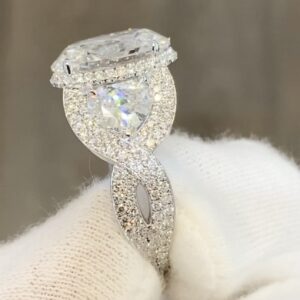 Oval Cut Halo Accent Side Stones